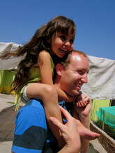 VE Global Volunteer with Child at Domingo Savio