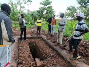 Ground breaking moment with family and builders