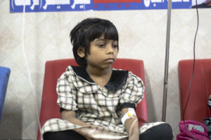 A kid recieving Iron Chelation medication