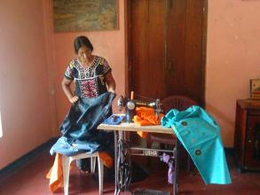 Mrs. Nallammah Vadivel Chooses Fabric for a Dress