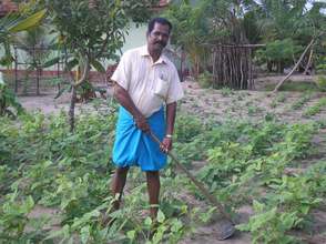 Selvam working on his farm