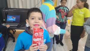 Child receiving their hygiene kit.