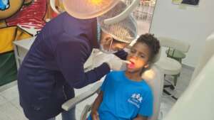 Child participating in the dental screening.