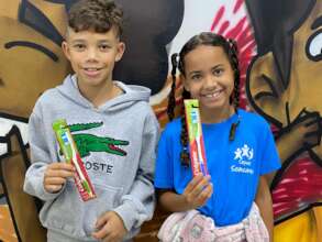Children receiving toothbrushes