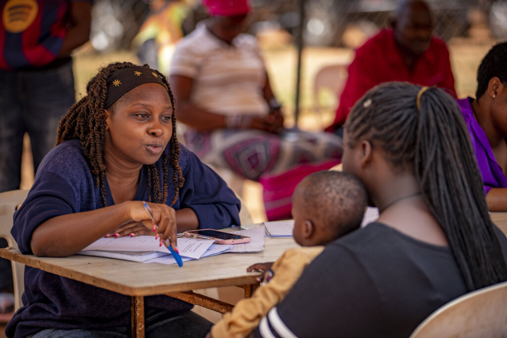 A legal Officer providing legal advise to a woman