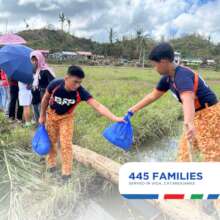 Volunteers hiking to bring goods to areas in need