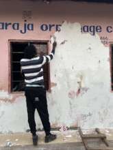 Volunteer working on the wall