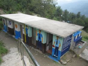 Painted toilet along with hand washing station