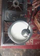 My mother boiling milk for children