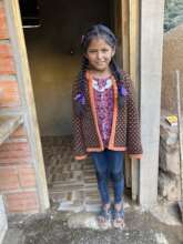 A young girl celebrating with her community