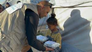 Food distribution in Palestinian refugee camp