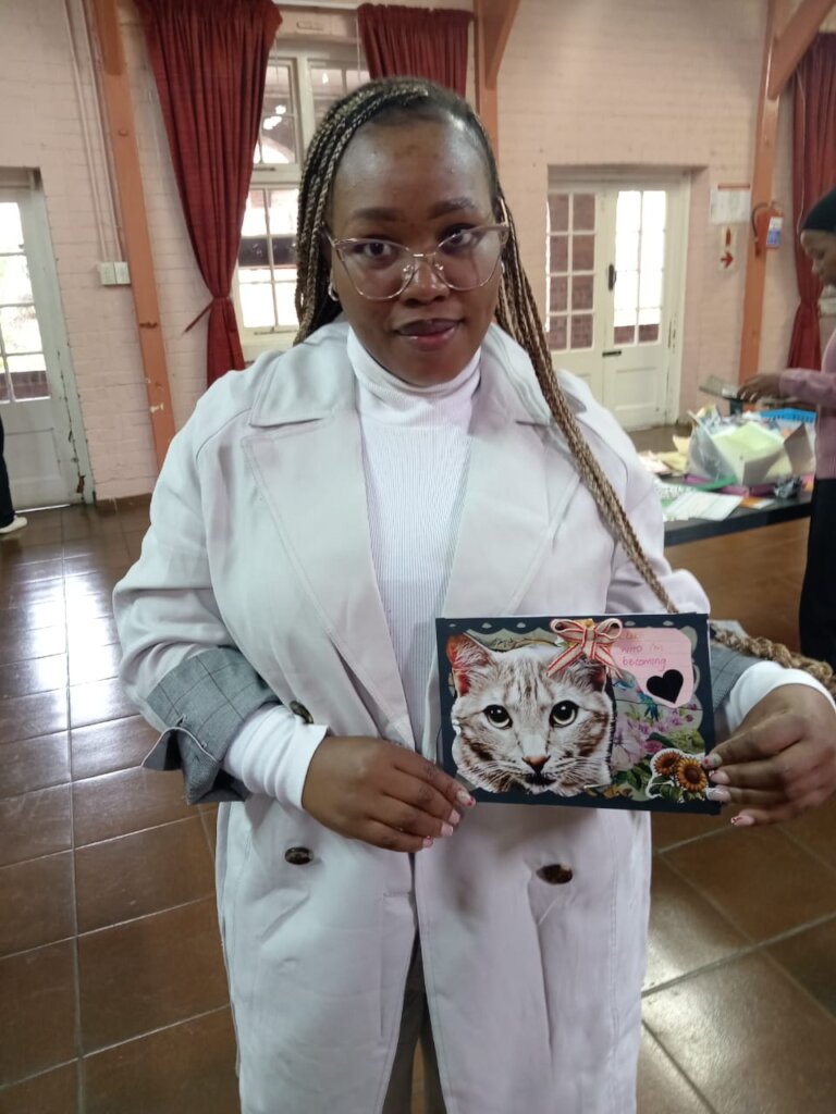 A proud trainee with her creative task