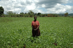 Farmer standing in the middle of her garden