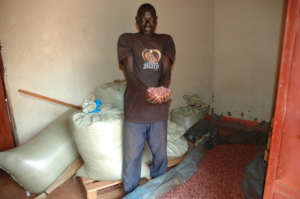 Our farmer's husband showing their yield of beans