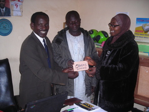 handing over  of the 25 USD to the P.T.A. chaiman