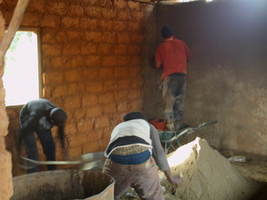 THE BRICKLAYER IS BUSY PLASTERING THE WALL