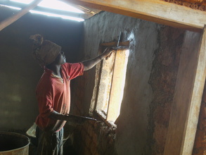 THE BRIKLAYER WORKING  DRESSING THE WINDOWS
