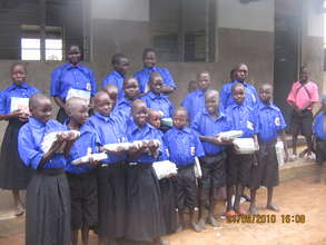 Children showing off their new school materials