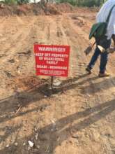 Warning signpost mounted to caution the public
