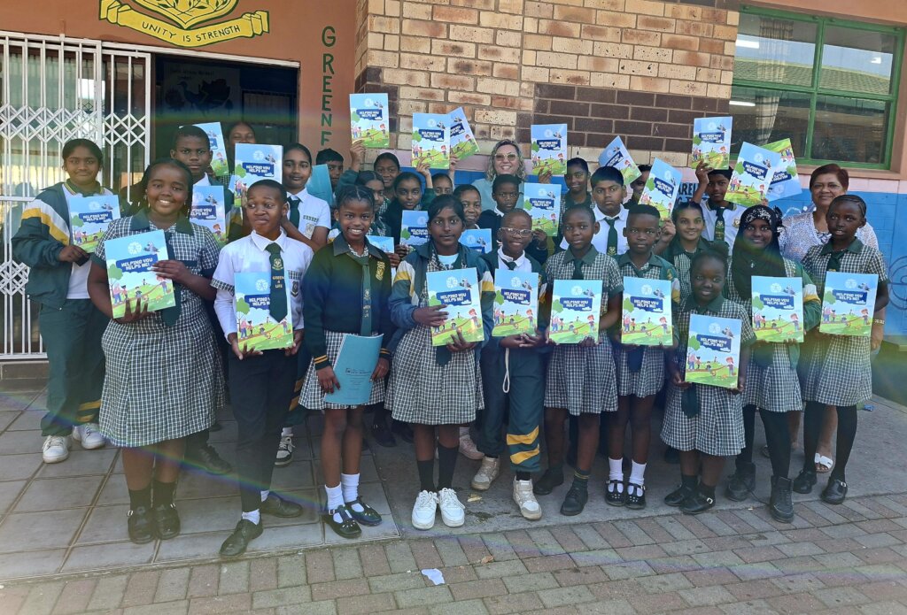 Learners from Acacia Primary receive their books