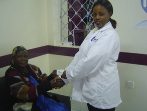 Lab Technician Catherine Wahu and Recipient