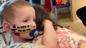 Ellis giving big sister Lily a hug