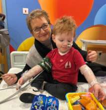 Ellis in hospital with Family Support Worker Jayne