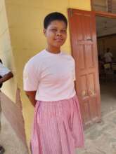 A beneficiary young woman dressed in the SHS unifo