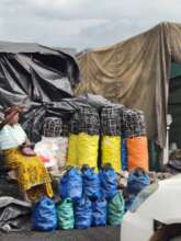 A woman selling charcoal, a popular fuel