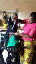 This hair salon helps pay for food and schooling