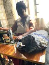 Busy sewing clothes for customers