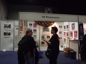 Rachel(r),speaks with AIDS conference participant
