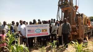 Our Founder-With the community at drilling site