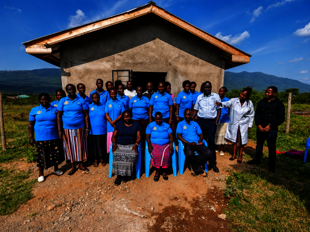 Kimuka CHEC members in front of the chicken coop