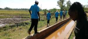 Maugo Village members prepare to clear the land