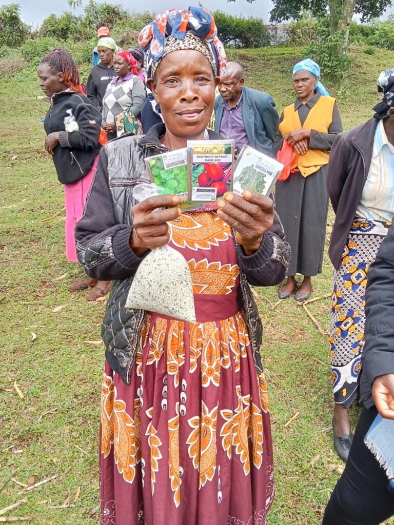 Nyamagesa CHEC Member with Seeds