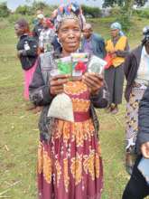 Nyamagesa CHEC Member with Seeds