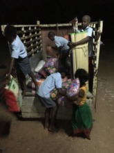 Some of the children helping unload new supplies.