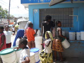 Waiting in line for hours to gather water