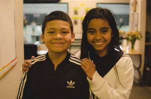Angel and Gemma filling buckets with kindness.