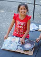 Gema reading about our world.