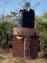 Water storage tank to collect water from the well