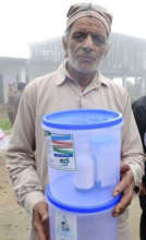 A villager with the water filter