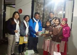 Children receive stationeries from ECCA rep.