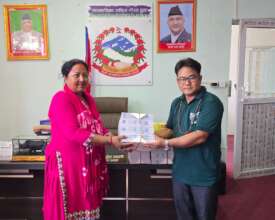 Stationery handed over to Gundi school teacher