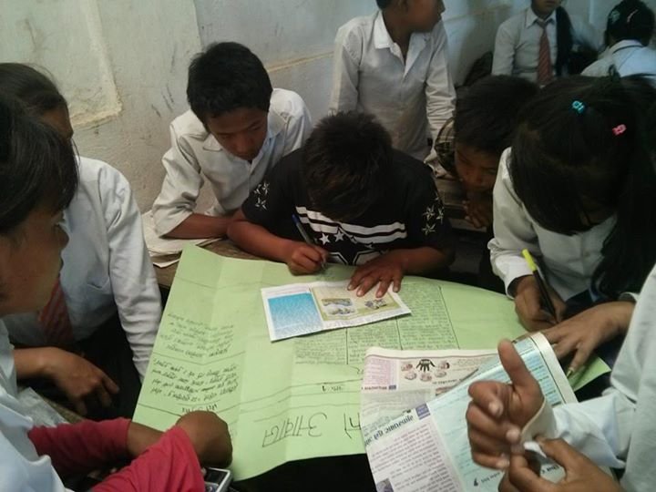 Students learning about wall magazine