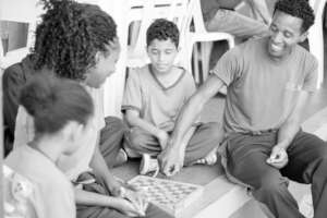 Students learning to play checkers.
