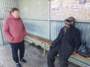 Dora Screens Nikolai at Bus Shelter