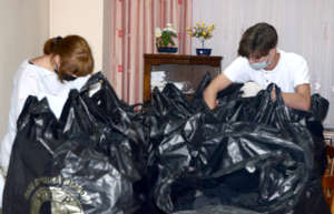 Irina & Vlad Mark Names on Donation Bags