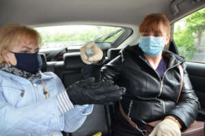 Lidia, left, and Vera, right, Sanitize Hands